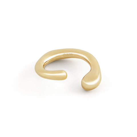 "Dusk women's ear cuff by Five Jwlry, part of Alicia Moffet's collaboration. This organically shaped piece elegantly wraps around the ear, requiring no piercing. Available in 14k gold or silver, crafted from water-resistant 316L stainless steel. Hypoallergenic with a 2-year warranty.
