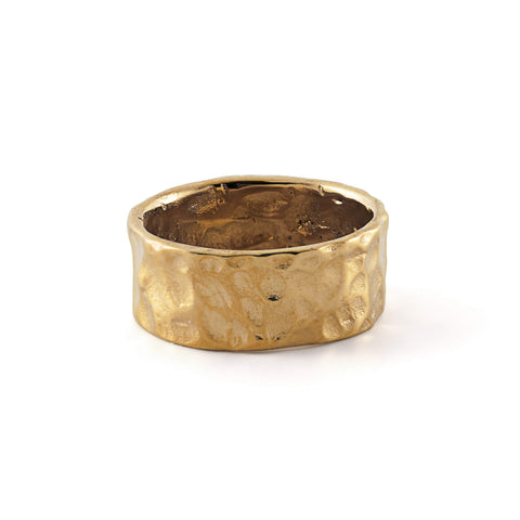 LUNE ring, designed in Montreal and made of waterproof and hypoallergenic stainless steel in a 14k gold hue. Its unique design boasts delicate bumps, embodying a perfectly imperfect aesthetic inspired by the lunar landscape with its craters and golden reflections.