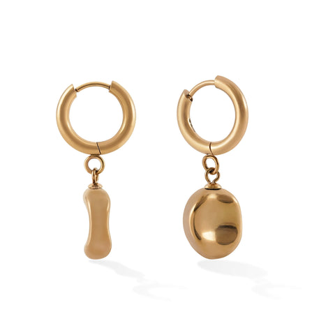 Alt text:  "Dawn women's pendant earring by Five Jwlry, born from Alicia Moffet's collaboration. This design marries a timeless hoop with a pendant resembling a water droplet, creating an illusion of molten metal frozen in time. Available in 14k gold or silver, made from water-resistant 316L stainless steel. Hypoallergenic with a 2-year warranty."