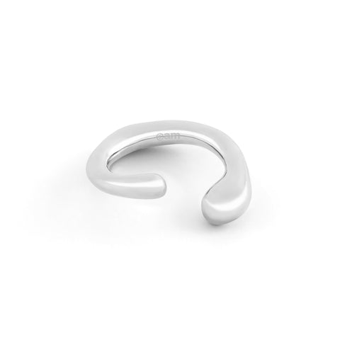 Dusk women's ear cuff by Five Jwlry, part of Alicia Moffet's collaboration. This organically shaped piece elegantly wraps around the ear, requiring no piercing. Available in 14k gold or silver, crafted from water-resistant 316L stainless steel. Hypoallergenic with a 2-year warranty.