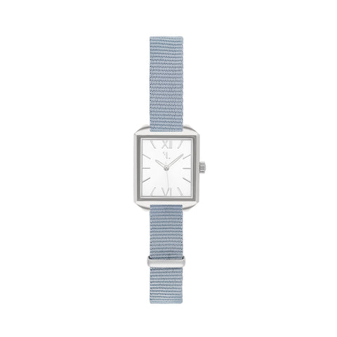 Ixelles watch by Five Jwlry, featuring a small square silver dial with matching silver case, handle, and baby blue nato bracelet. Designed in Montreal, it offers quartz movement, 5ATM water resistance, and a 2-year warranty. Comes with an interchangeable bracelet using the easy release function